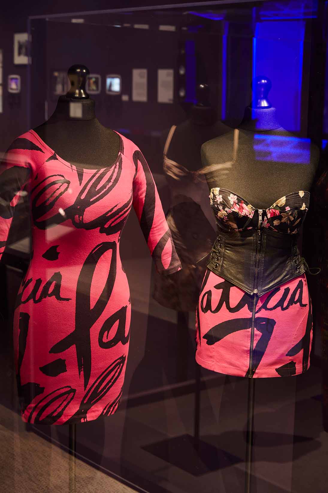 The pink graphic dress that Amy wore around Camden in 2010 and the look she wore to the 2007 Q Awards, the skirt and dress are designed by Patricia Field
