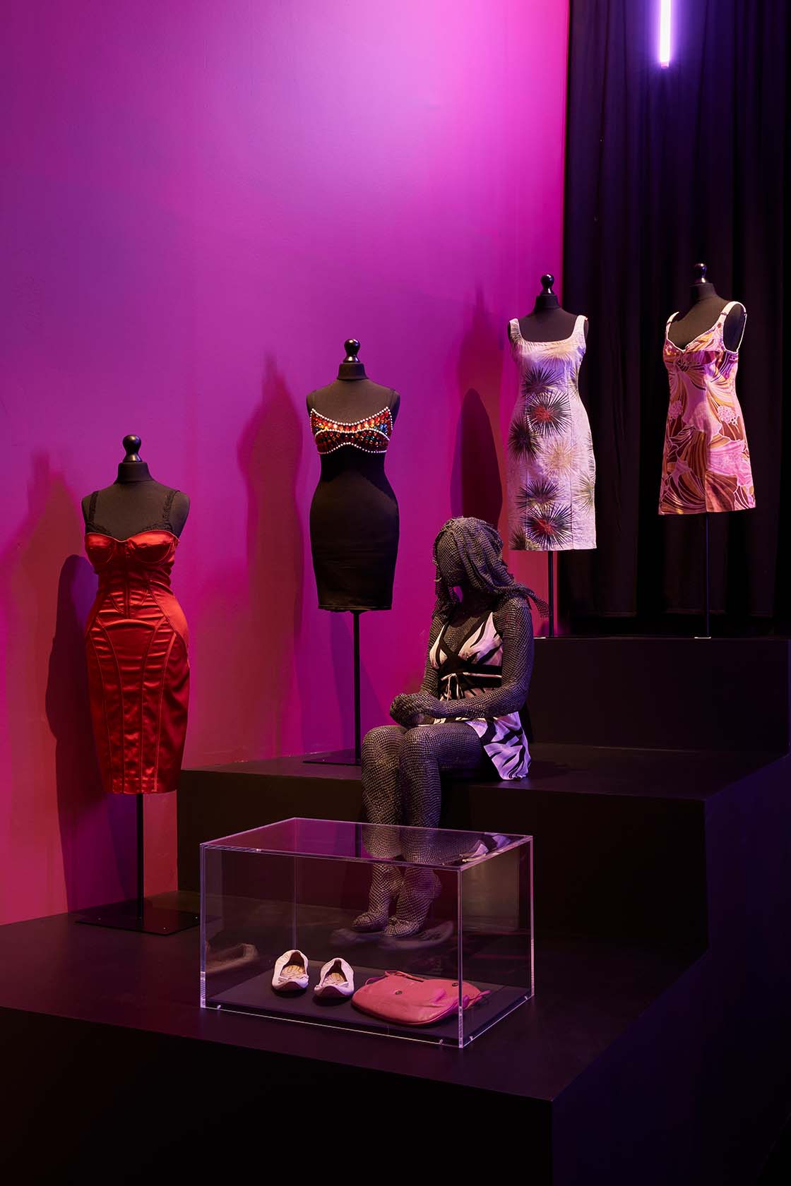 The fashion section, displaying garments that Amy wore to key performances against a backdrop of screens examining her unique style