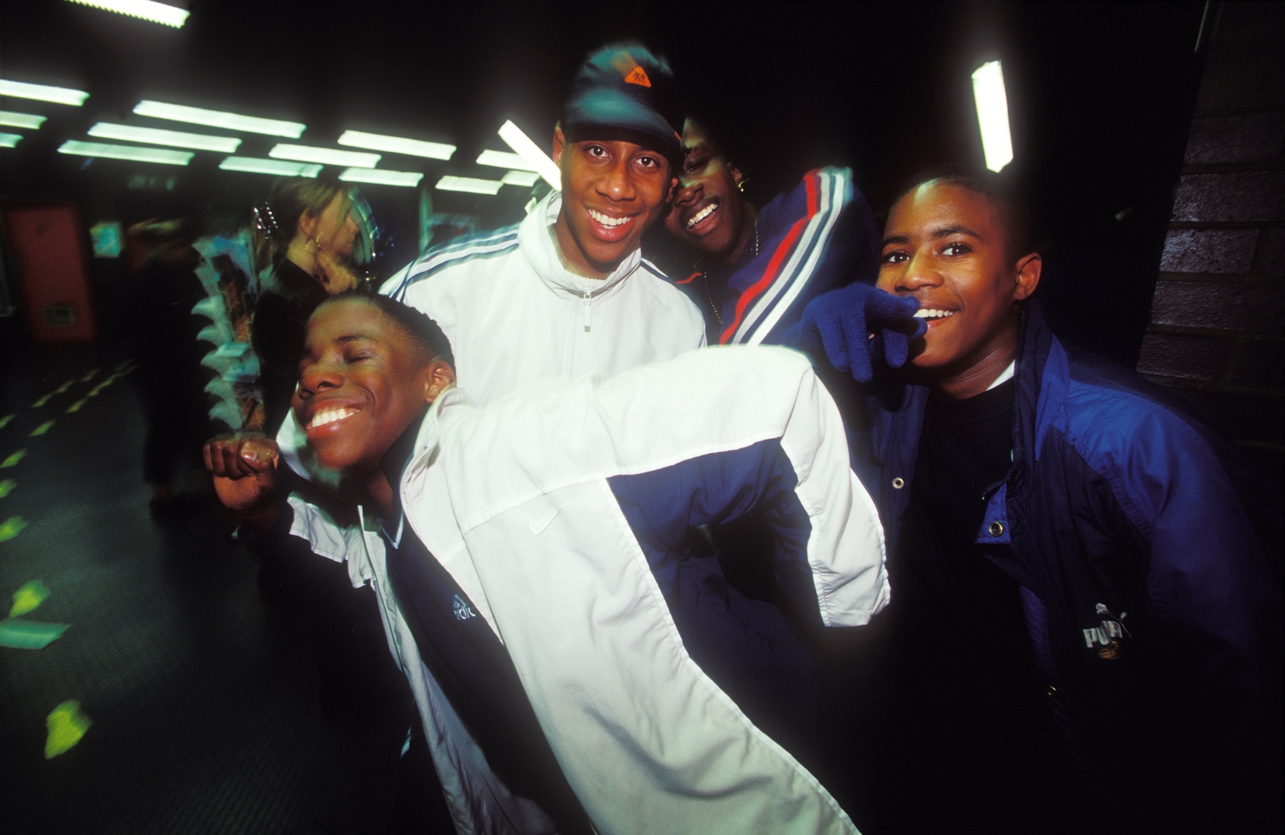 Four boys in shell suits at Club It, London, 1999 by Gordon Munro